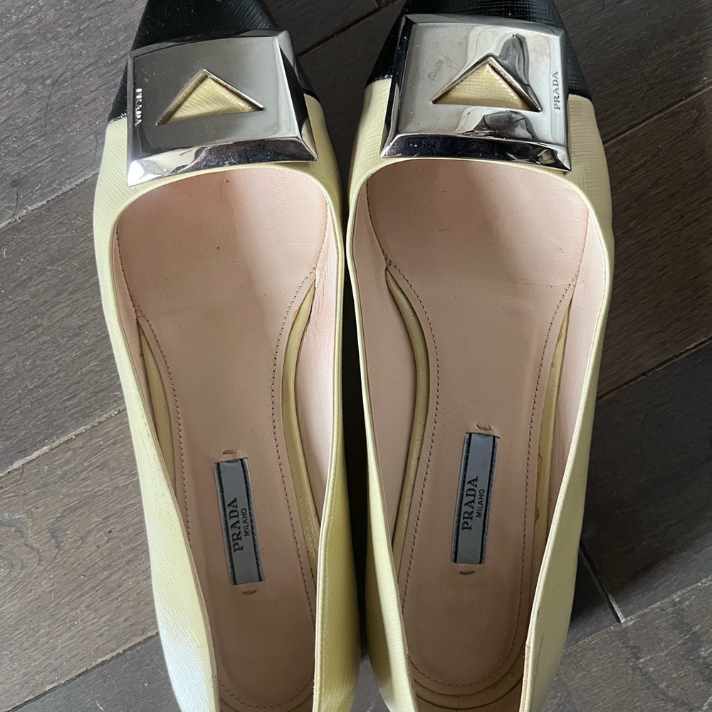 Prada Cream and Black Flats with Metallic Ornament